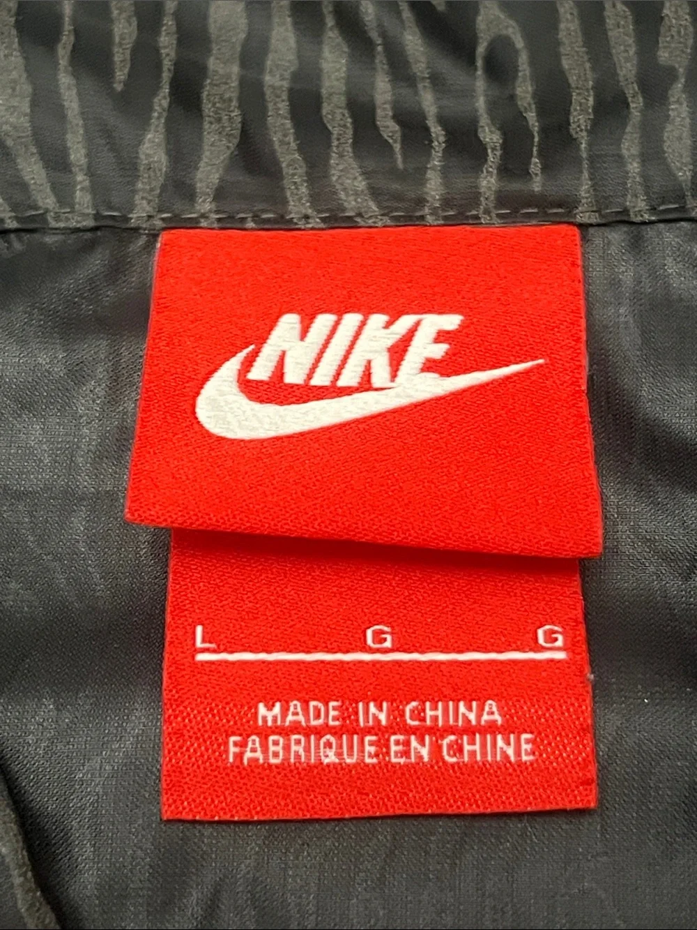 Nike Women’s Black with Gray Patterned Hooded Windbreaker Jacket